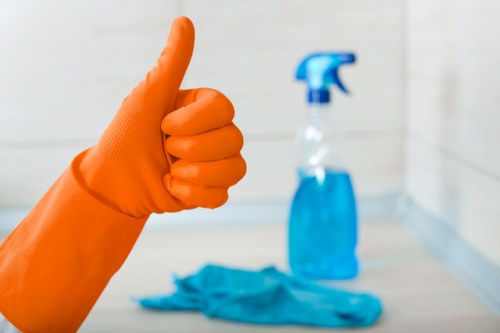 Professional cleaning team working in an E11 property