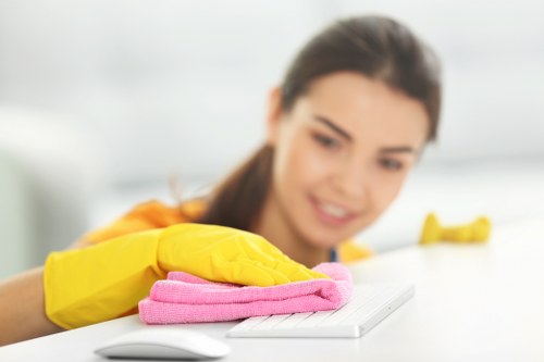 Commercial cleaning tasks in an E11 office kitchen and reception area