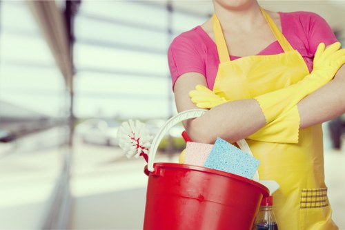 Professional cleaners maintaining a workplace in E11 with careful attention to detail